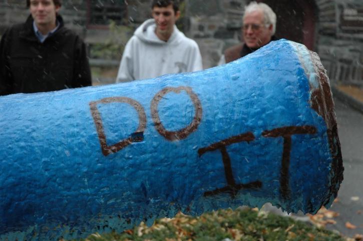 Brian McNamara, Josh Kennedy and Coach Connie Putnam admire the painted cannon.