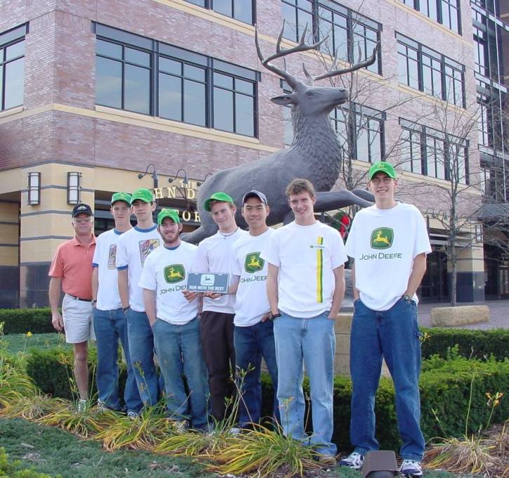 group in front of the big deer