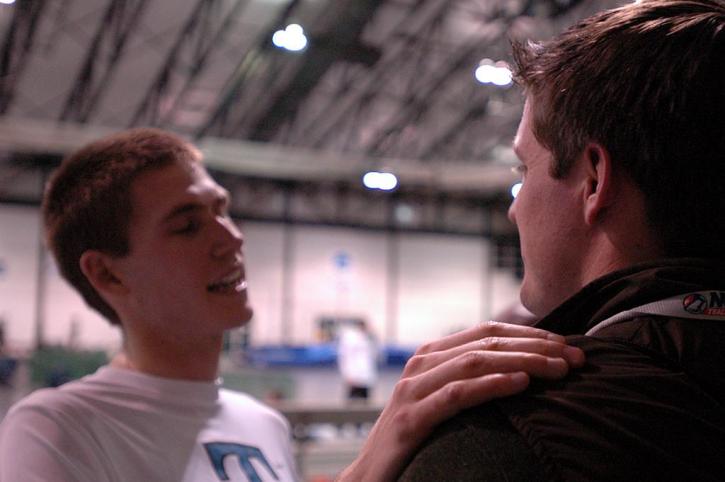 Nate Brigham and Coach Hob Brooks chat after the 5000.