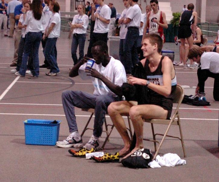 Nate Brigham and 5000 winner Macharia Yuot (Widener) unwind after the race.