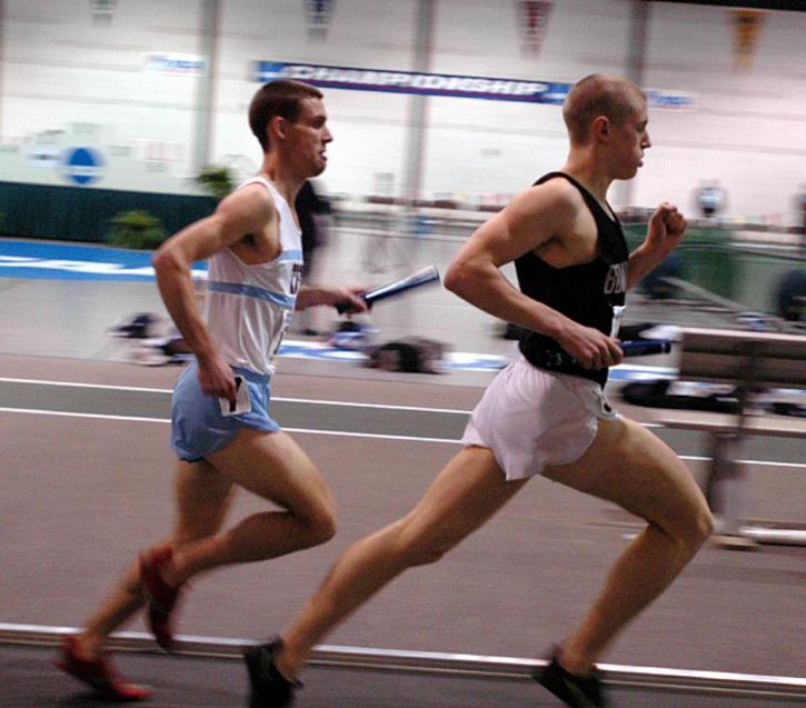 Matt Fortin runs with Andrew Combs of Bowdoin.