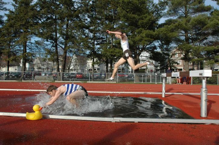 Dave Sorenson in mid air in the steeplechase.