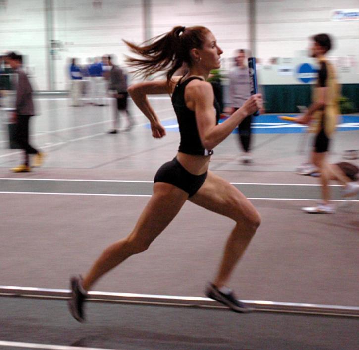 Rachel Bloom has the baton for the 400 leg of the DMR.