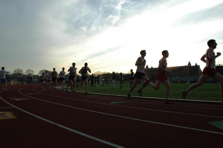 Mike Don and the other 5k competitors run the 5k as the sun begins to fall.