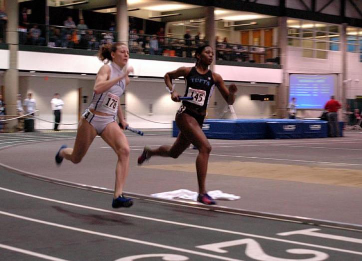 Jillian Warner races against Wheaton in the 4x400 final.