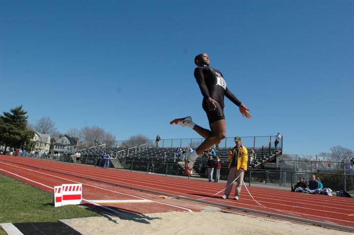 Fred Jones in mid-flight during the long jump