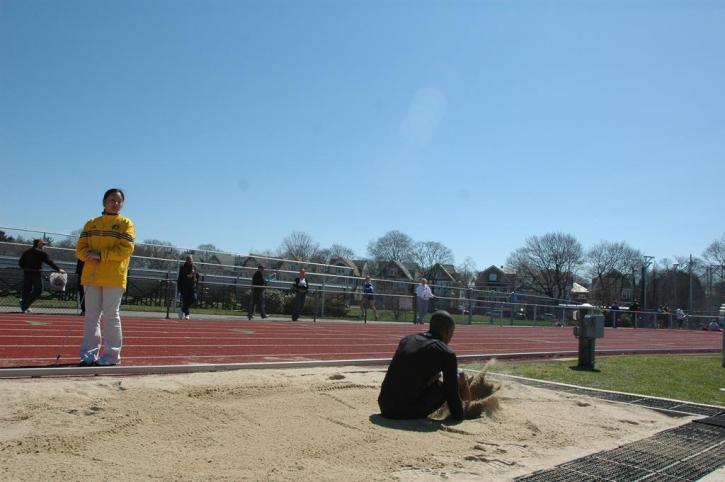 Fred Jones makes a landing in the long jump