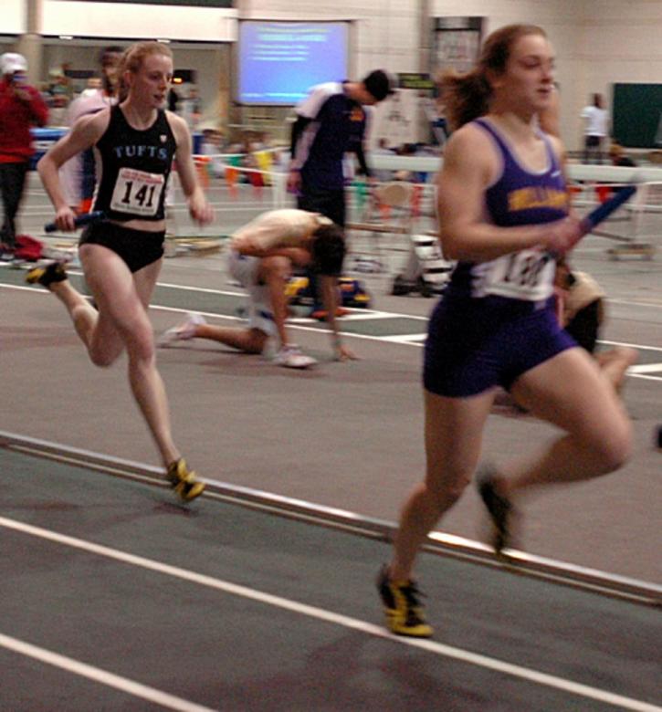 Kaleigh Fitzpatrick chases Williams in the 4x400 trials.