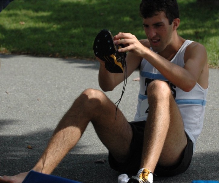 Josh Kennedy puts on shoes