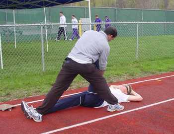 coach loeb stretching mann before the steeple