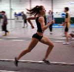 Rachel Bloom has the baton for the 400 leg of the DMR.