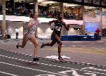 Jillian Warner races against Wheaton in the 4x400 final.