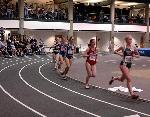 Catherine Beck runs with the main pack in the 5000.