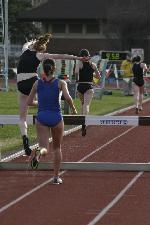 Catherine Beck, Katy O'Brien and Liz Bloomhardt work their way around the track in the steeplechase.