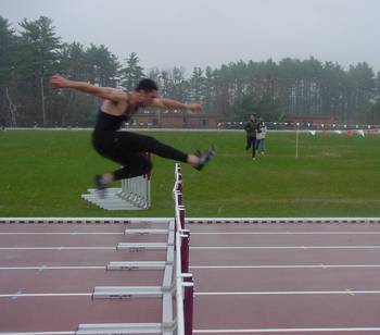 devine over the last hurdle in the 400IH